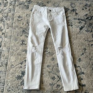 Boys size 10 white jeans with rips in them.